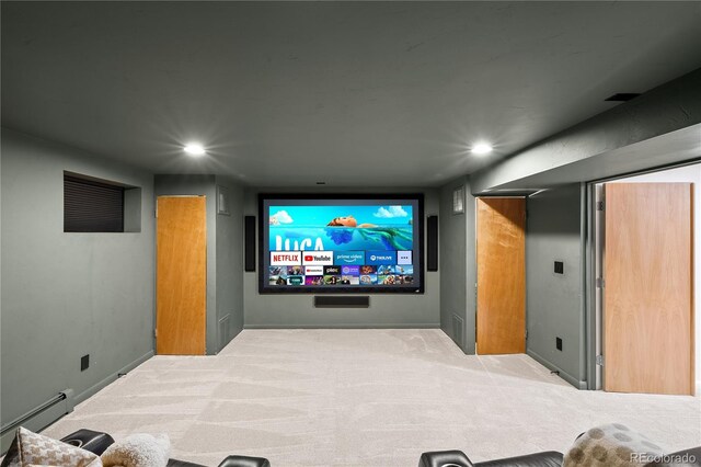 carpeted home theater room with a baseboard radiator, baseboards, and recessed lighting