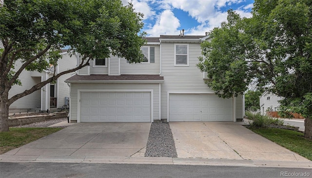 5531 S Quemoy Cir, Aurora, CO 80015 - view of front facade with an attached garage and driveway