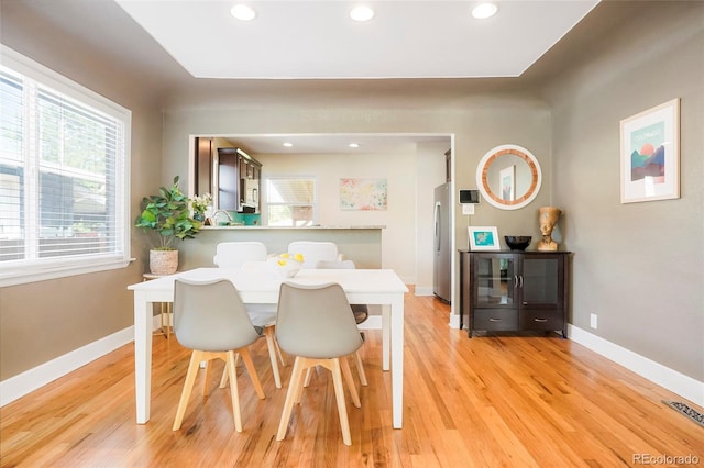 dining room with light wood-type flooring