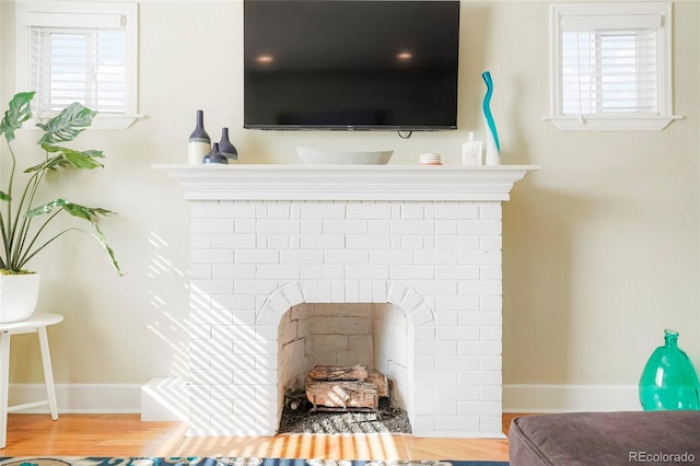 room details featuring hardwood / wood-style floors and a fireplace