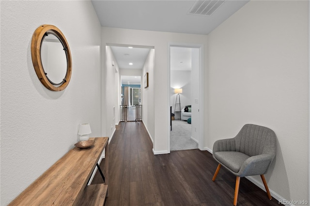 hallway featuring dark hardwood / wood-style flooring