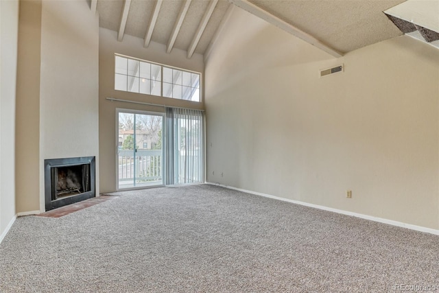 unfurnished living room featuring beam ceiling, carpet floors, and high vaulted ceiling