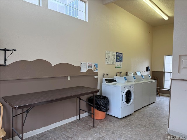 washroom with a healthy amount of sunlight and washer and dryer