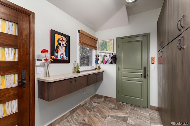 interior space with marble finish floor and baseboards