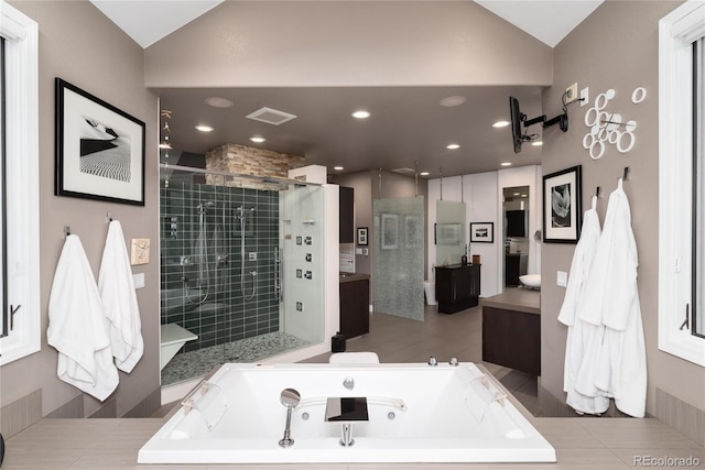 full bath featuring a shower stall, vanity, visible vents, a whirlpool tub, and lofted ceiling