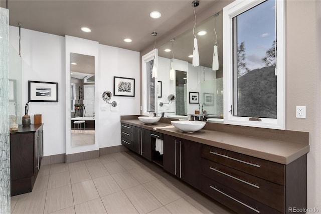 full bath with tile patterned floors, recessed lighting, double vanity, and a sink