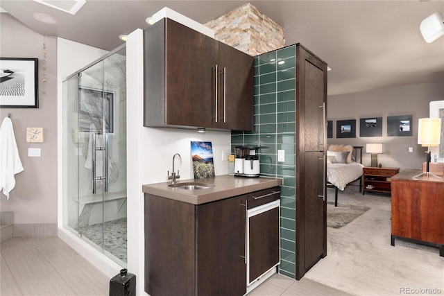 kitchen featuring a sink and dark brown cabinets