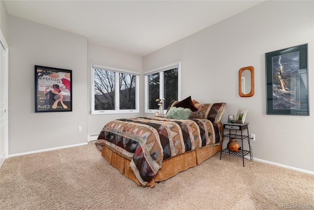 bedroom with baseboard heating, carpet flooring, and baseboards