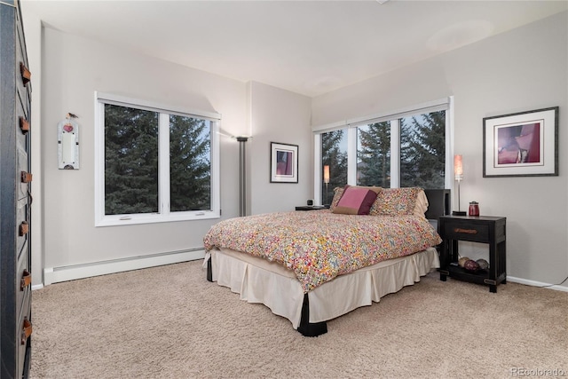 bedroom featuring baseboards, light carpet, and baseboard heating