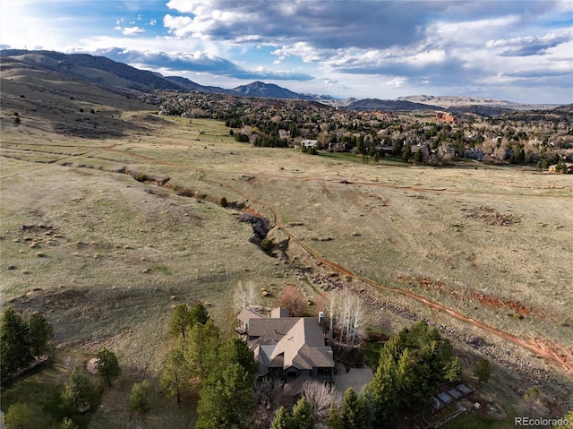 drone / aerial view featuring a mountain view
