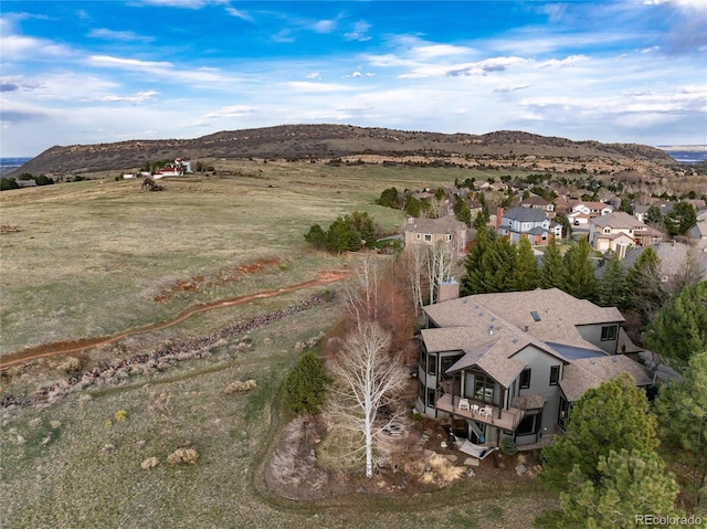 drone / aerial view featuring a mountain view and a residential view