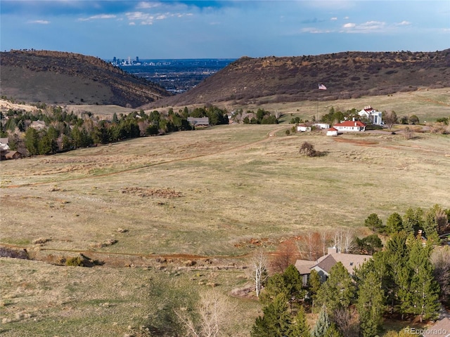 mountain view featuring a rural view