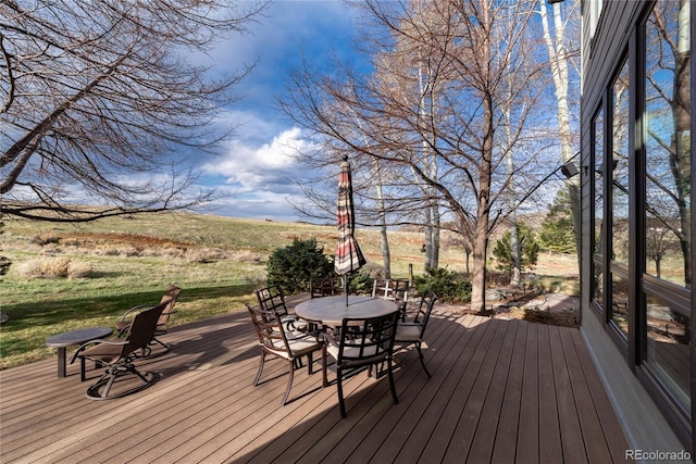 wooden deck with outdoor dining space