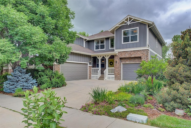 1839 Caleta Trl, Longmont, CO 80504 - craftsman house featuring stone siding, driveway, board and batten siding, and a garage