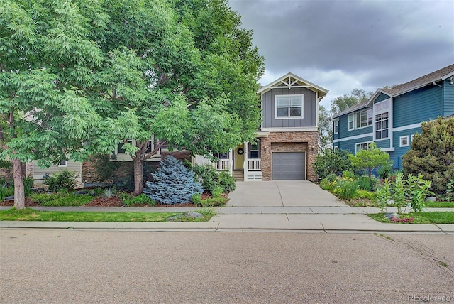 1839 Caleta Trl, Longmont, CO 80504 - craftsman house featuring stone siding, board and batten siding, driveway, and an attached garage