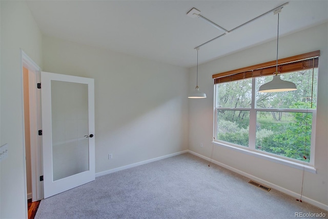 1839 Caleta Trl, Longmont, CO 80504 - unfurnished room featuring carpet flooring and attic access