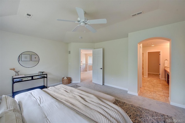 1839 Caleta Trl, Longmont, CO 80504 - bedroom featuring arched walkways, light colored carpet, and ceiling fan