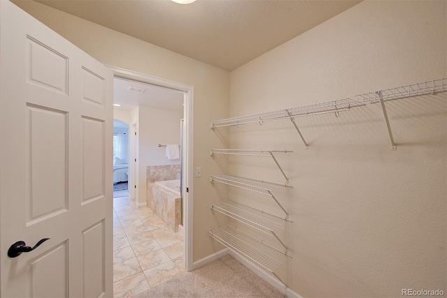 1839 Caleta Trl, Longmont, CO 80504 - walk in closet featuring light marble finish floors