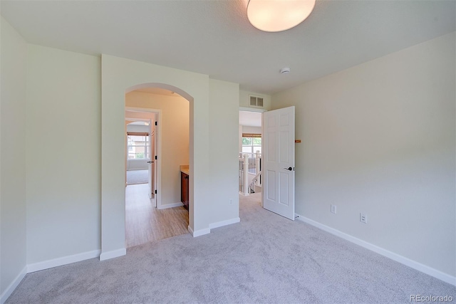 1839 Caleta Trl, Longmont, CO 80504 - unfurnished bedroom with arched walkways and light carpet