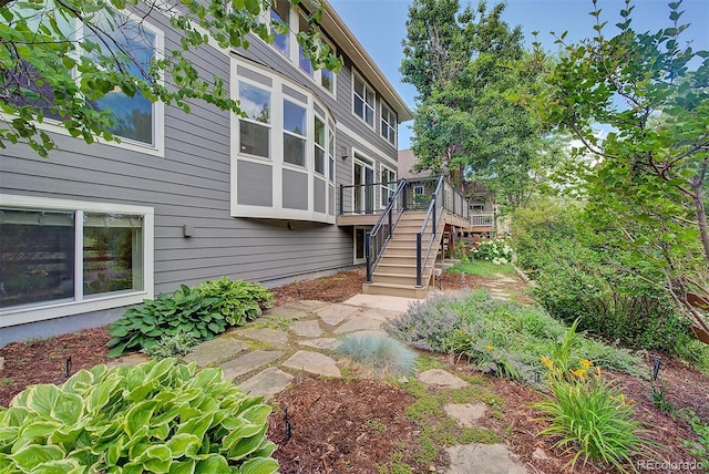 1839 Caleta Trl, Longmont, CO 80504 - view of side of property featuring stairs and a wooden deck