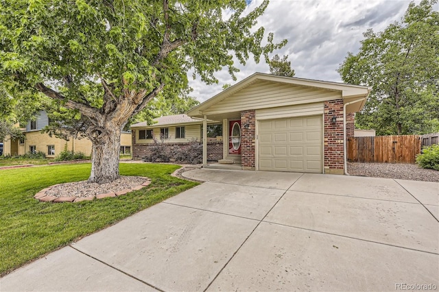 ranch-style home featuring a garage and a front yard