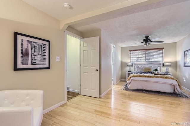 bedroom featuring ceiling fan and light wood-type flooring