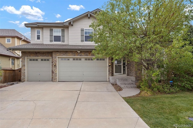 view of front facade featuring a front lawn and a garage