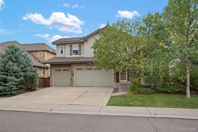 view of front of home featuring a garage and a front lawn