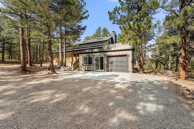 view of side of home with a garage