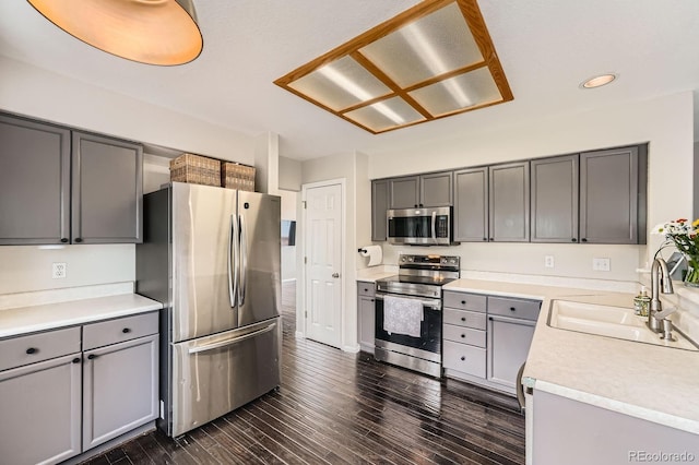 4567 Flanders Way, Denver, CO 80249 - kitchen featuring stainless steel appliances, a sink, gray cabinets, recessed lighting, and dark wood-style flooring