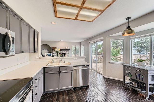 4567 Flanders Way, Denver, CO 80249 - kitchen with appliances with stainless steel finishes, a sink, gray cabinets, plenty of natural light, and recessed lighting