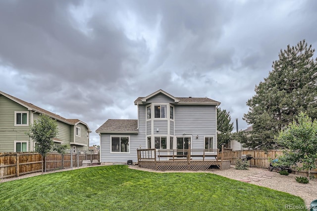 4567 Flanders Way, Denver, CO 80249 - back of property featuring a wooden deck and roof with shingles