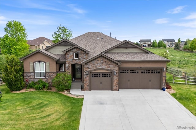 8101 Wynstone Dr, Windsor, CO 80550 - view of front of home with a shingled roof, an attached garage, concrete driveway, stucco siding, and stone siding