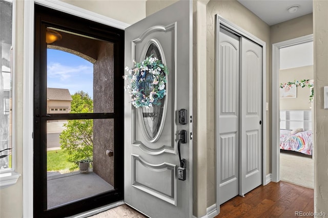 8101 Wynstone Dr, Windsor, CO 80550 - entryway with wood finished floors and plenty of natural light