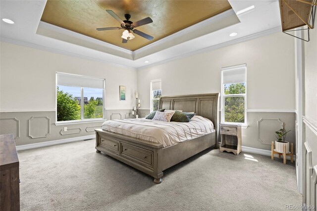 8101 Wynstone Dr, Windsor, CO 80550 - bedroom with ornamental molding, carpet floors, a tray ceiling, multiple windows, and recessed lighting