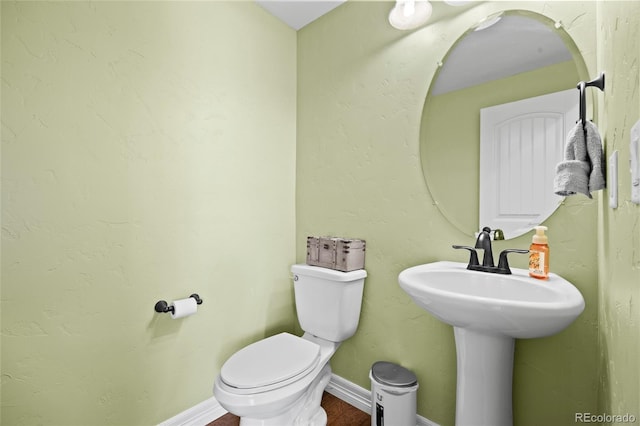 8101 Wynstone Dr, Windsor, CO 80550 - half bathroom featuring toilet and baseboards
