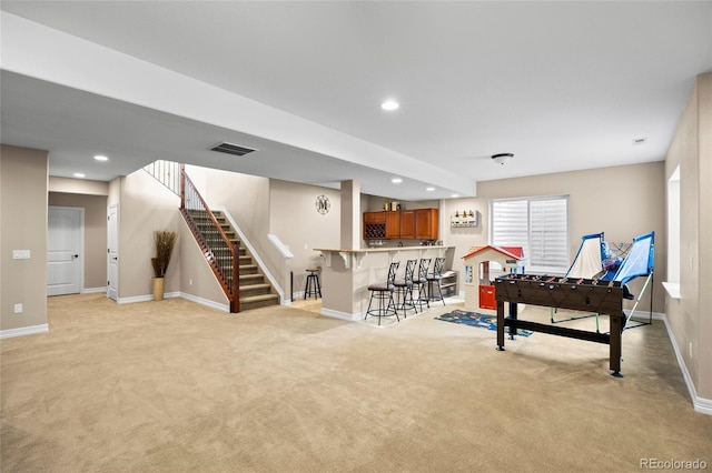 8101 Wynstone Dr, Windsor, CO 80550 - playroom featuring light colored carpet, bar area, baseboards, and recessed lighting