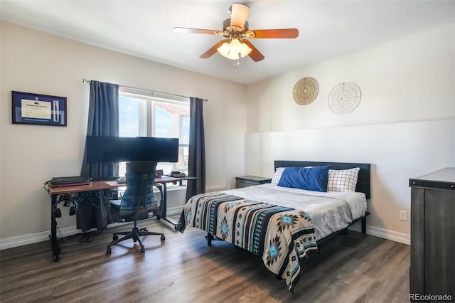 bedroom with ceiling fan and dark hardwood / wood-style floors