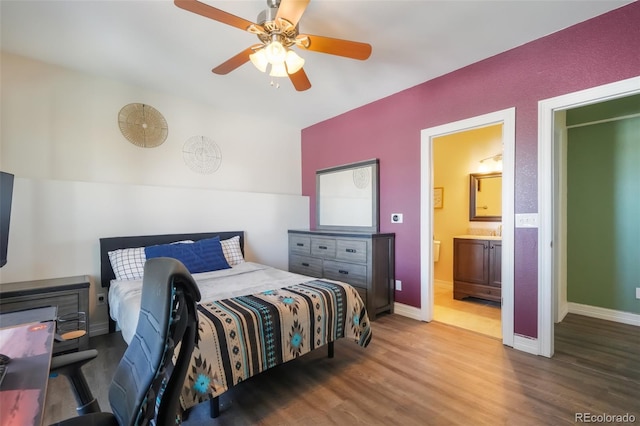 bedroom with wood-type flooring, ensuite bath, and ceiling fan