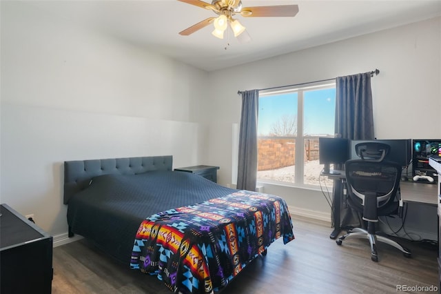 bedroom with hardwood / wood-style floors and ceiling fan