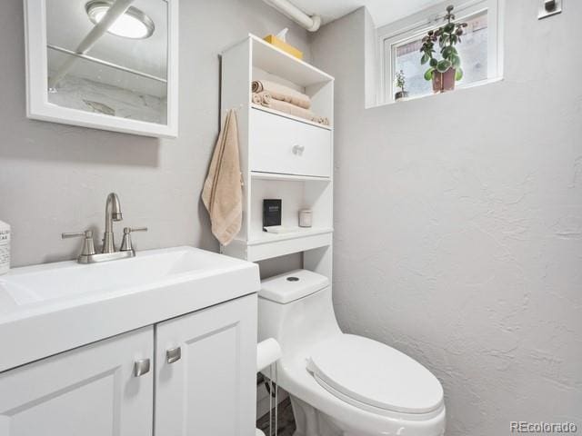 2995 Albion St, Denver, CO 80207 - bathroom featuring toilet and vanity