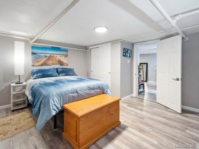 2995 Albion St, Denver, CO 80207 - bedroom featuring baseboards and light wood-type flooring