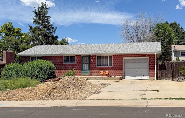 8771 Rutgers St, Westminster, CO 80031 - single story home featuring a garage, brick siding, driveway, and a shingled roof