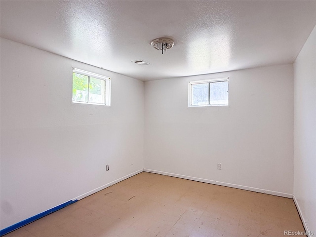8771 Rutgers St, Westminster, CO 80031 - below grade area featuring plenty of natural light and a textured ceiling