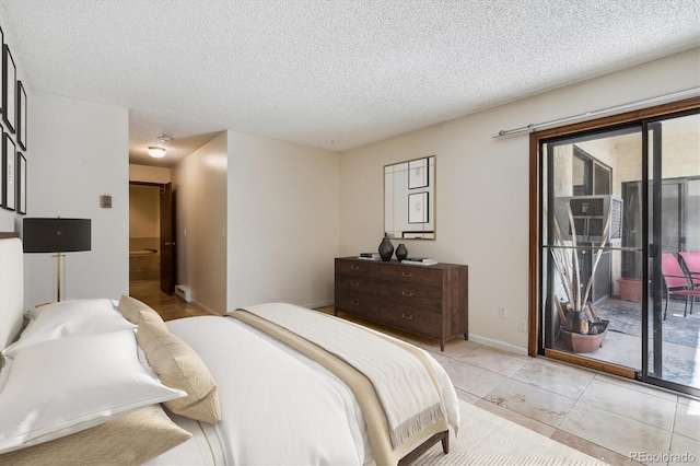 13950 E Oxford Pl Unit B105, Aurora, CO 80014 - bedroom with access to exterior and a textured ceiling