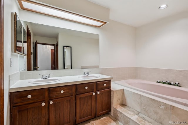13950 E Oxford Pl Unit B105, Aurora, CO 80014 - bathroom featuring double vanity and a garden tub
