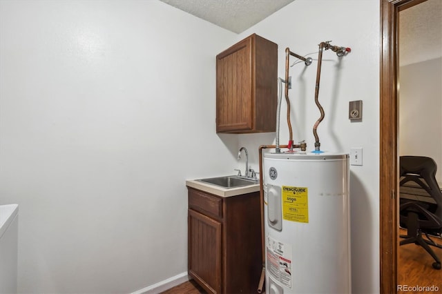 13950 E Oxford Pl Unit B105, Aurora, CO 80014 - utility room featuring water heater and a sink