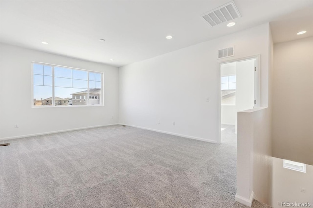 empty room with light colored carpet