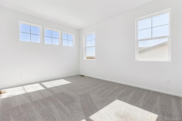 unfurnished room with carpet flooring