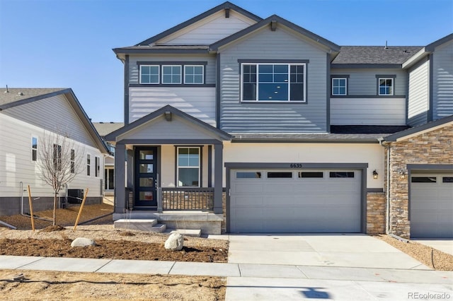 view of front of home with central AC unit, a garage, and a porch